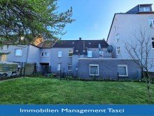 R�ckansicht mit Logo Bezahlbares Ein-/ Zweifamilienhaus in Gelsenkirchen Buer