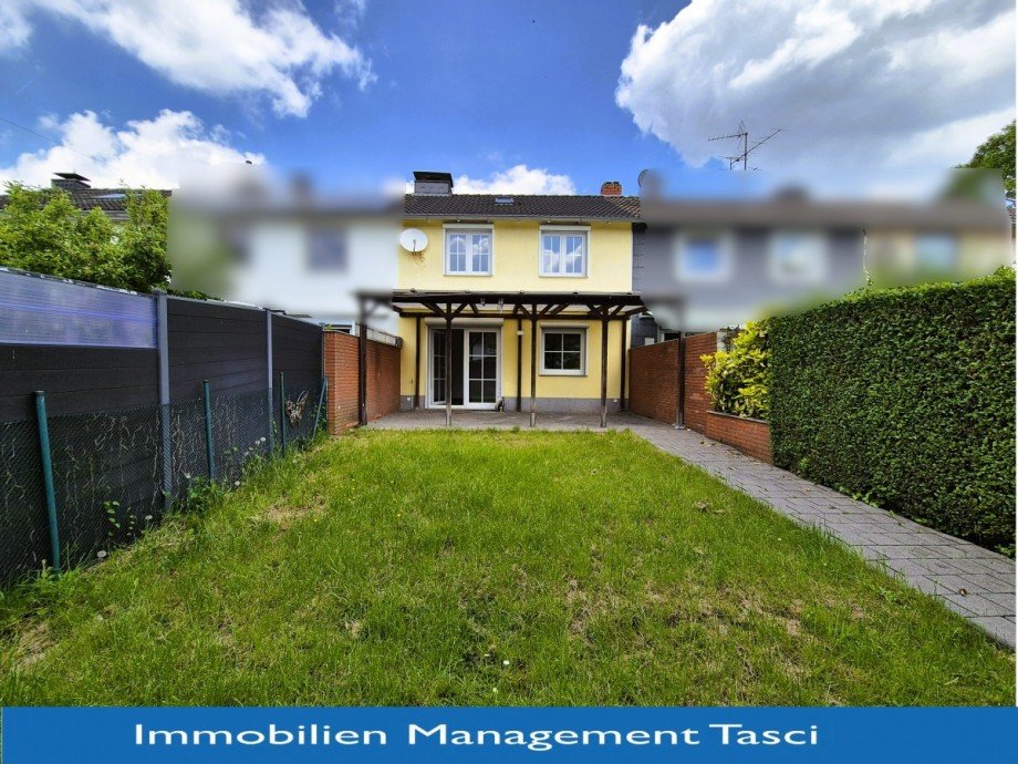 R�ckansicht mit Logo... Reihenmittelhaus Gladbeck